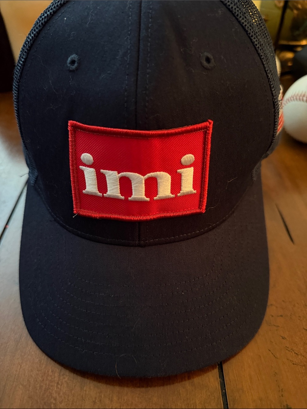 Mi Black Trucker Hat with Red Patch and White Logo
